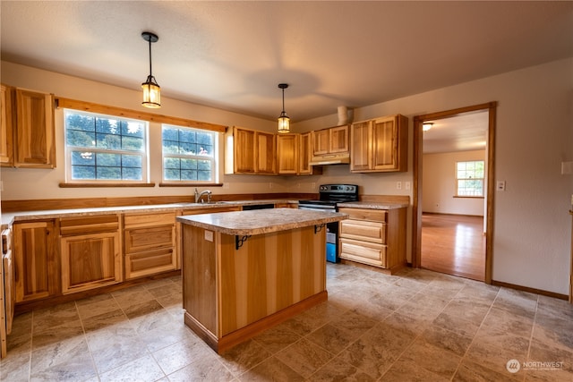 kitchen with pendant lighting, light tile floors, sink, range with electric stovetop, and a kitchen island