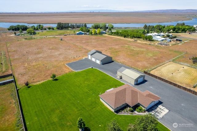 aerial view with a water view and a rural view