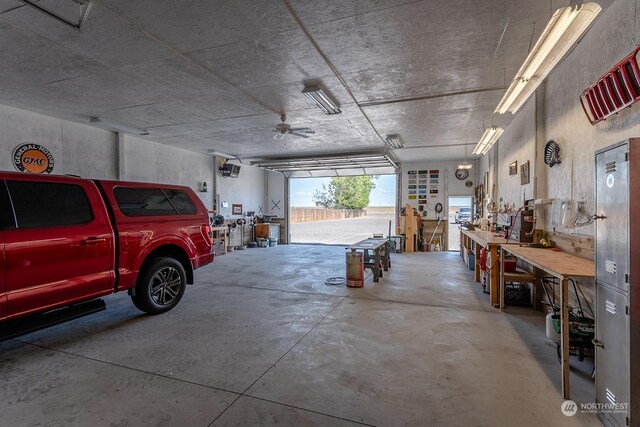 garage featuring a workshop area and ceiling fan