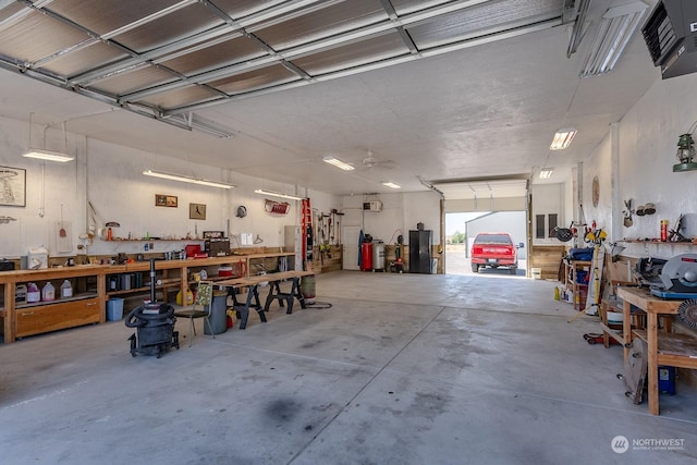 garage featuring a workshop area and a garage door opener