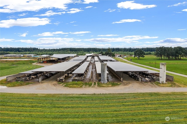 birds eye view of property with a rural view