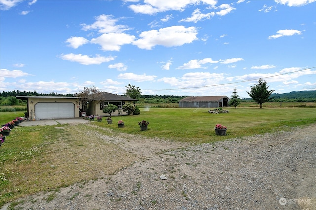 ranch-style home with a front lawn and a garage