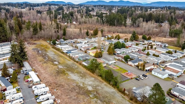 birds eye view of property featuring a mountain view