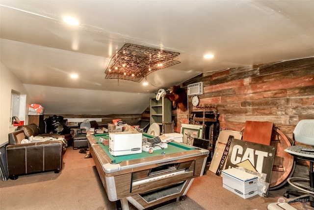 recreation room with wooden walls, a wall mounted AC, billiards, vaulted ceiling, and light carpet