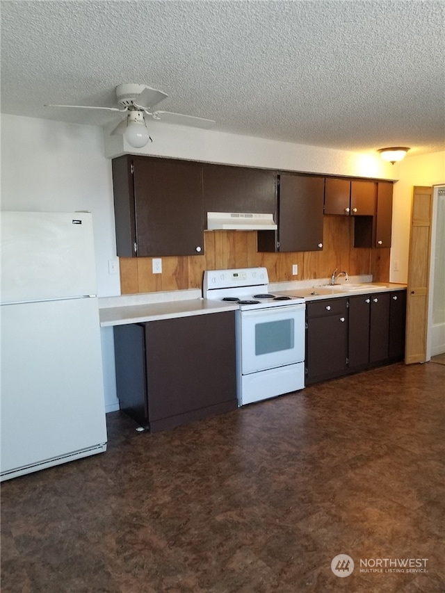 kitchen featuring white appliances, a textured ceiling, and ceiling fan