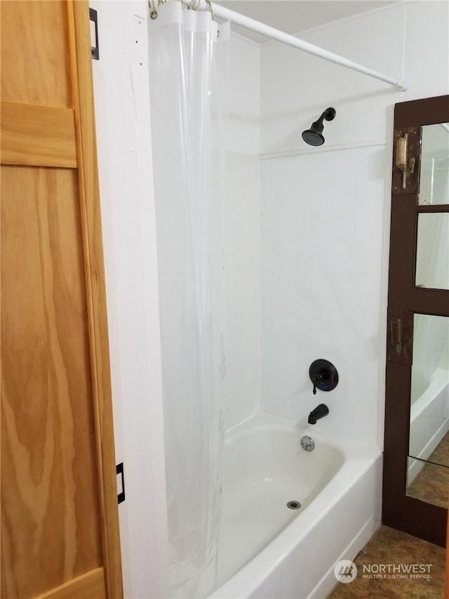 bathroom featuring shower / tub combo with curtain