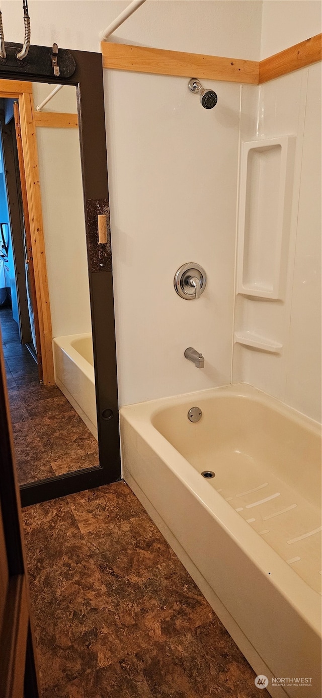 bathroom featuring  shower combination