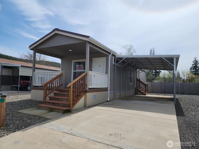 2010 Broadway Ave Unit 41, Hoquiam, WA 98550 - manufactured / mobile home with fence, covered porch, an attached carport, and driveway
