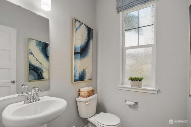 bathroom featuring sink and toilet