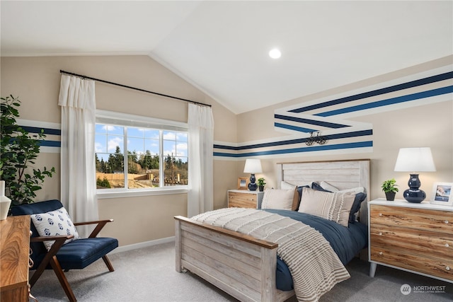 bedroom with vaulted ceiling and carpet