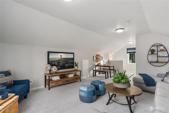 living room with lofted ceiling and light carpet