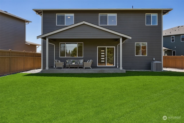 rear view of house with outdoor lounge area, central AC, a patio area, and a lawn