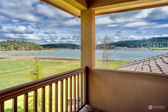 balcony featuring a water view