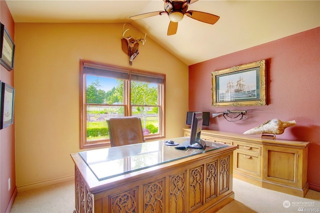 carpeted office space featuring lofted ceiling and ceiling fan