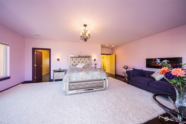 bedroom featuring a notable chandelier