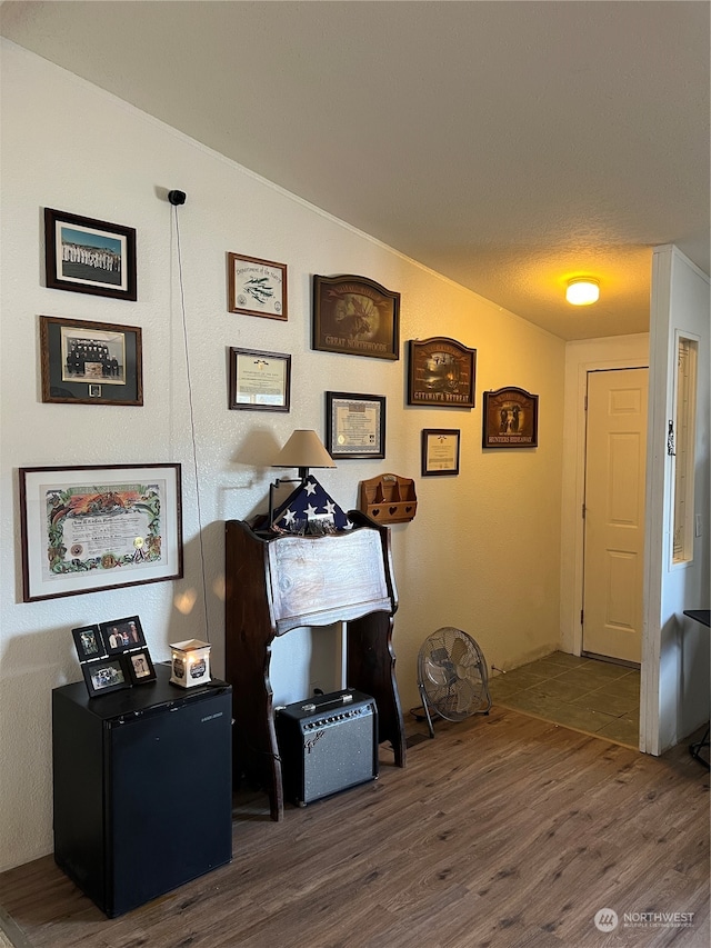 office space with dark wood-type flooring