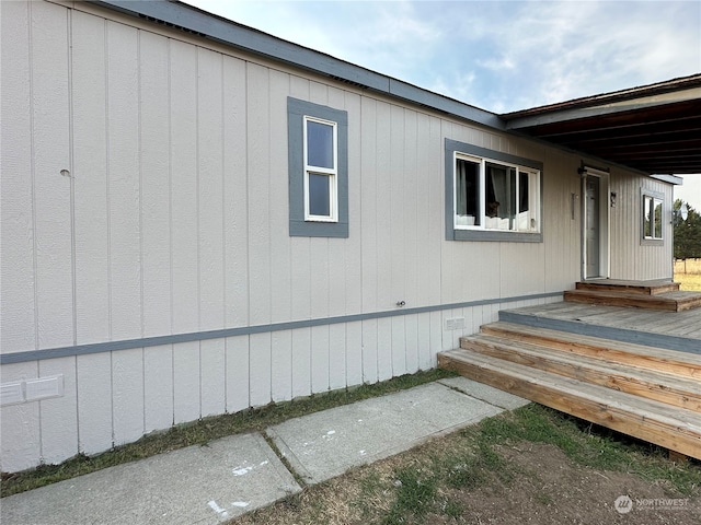 view of home's exterior featuring a wooden deck