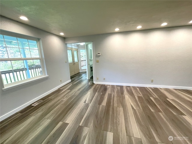 653 Sunset Ave NE, Ocean Shores, WA 98569 - unfurnished room with dark hardwood / wood-style flooring