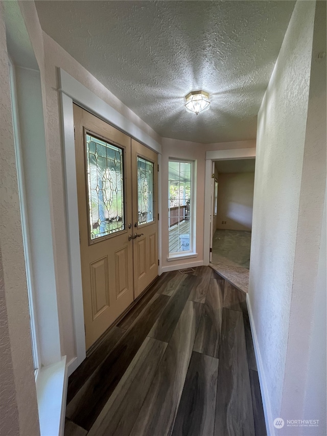 653 Sunset Ave NE, Ocean Shores, WA 98569 - interior space with a textured ceiling and dark wood-type flooring
