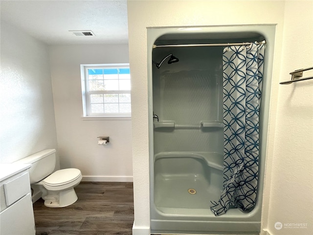 653 Sunset Ave NE, Ocean Shores, WA 98569 - bathroom featuring toilet and hardwood / wood-style floors