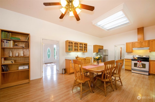 dining area featuring ceiling fan and light wood-type flooring