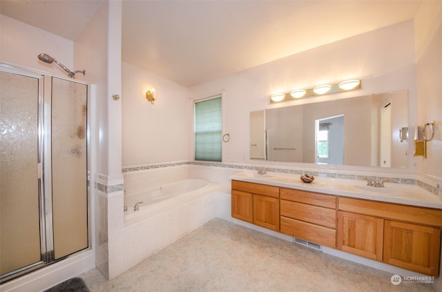 bathroom with double sink, shower with separate bathtub, and large vanity