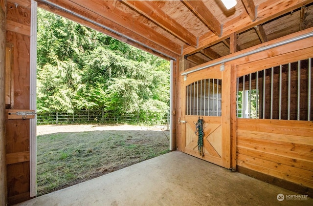 view of horse barn with an outdoor structure