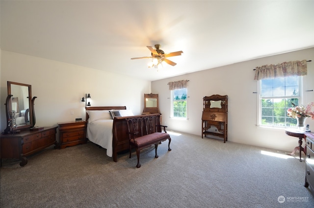 bedroom with multiple windows, carpet, and ceiling fan