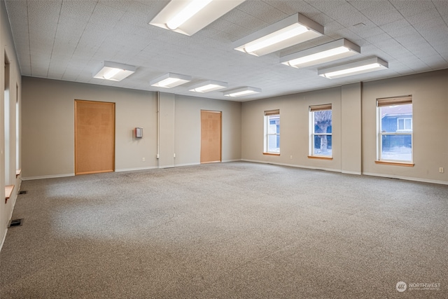 unfurnished room featuring carpet flooring