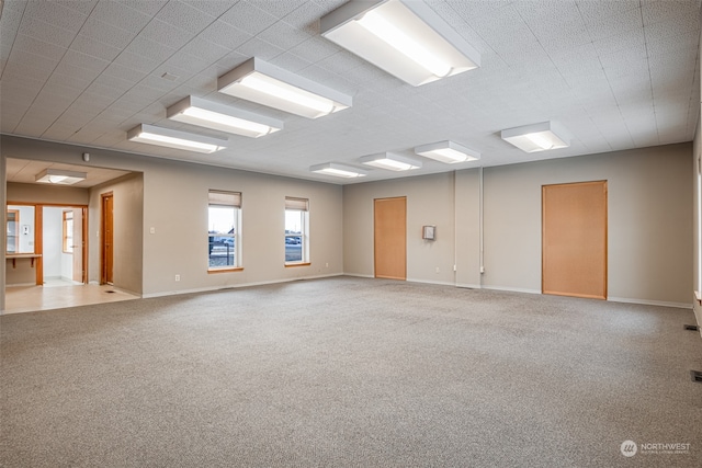 empty room featuring light carpet