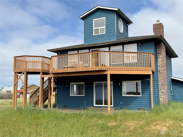 back of house featuring a deck