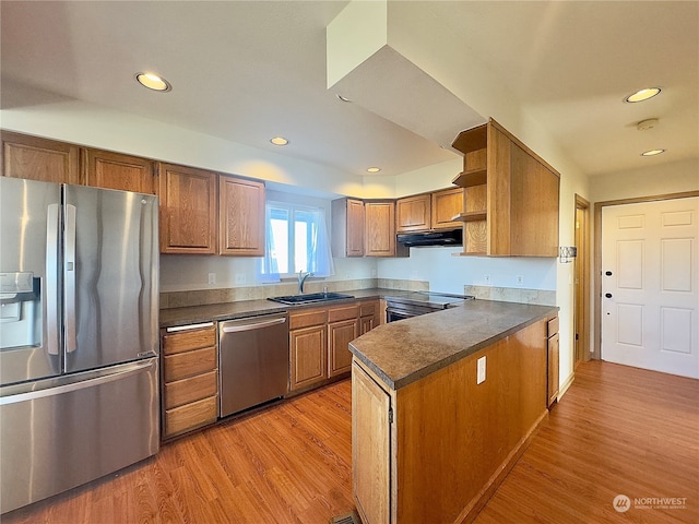 kitchen featuring sink, stainless steel appliances, and light hardwood / wood-style floors