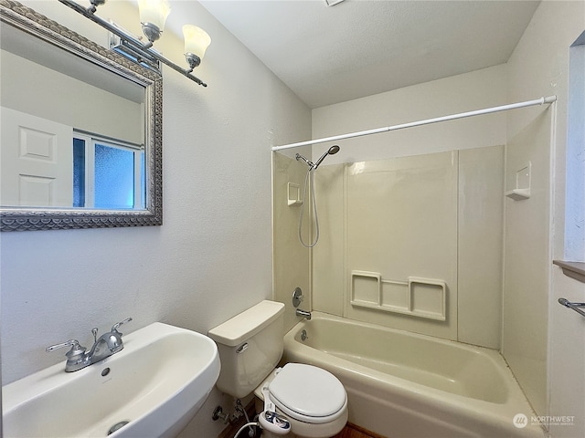 full bathroom with tub / shower combination, sink, and toilet