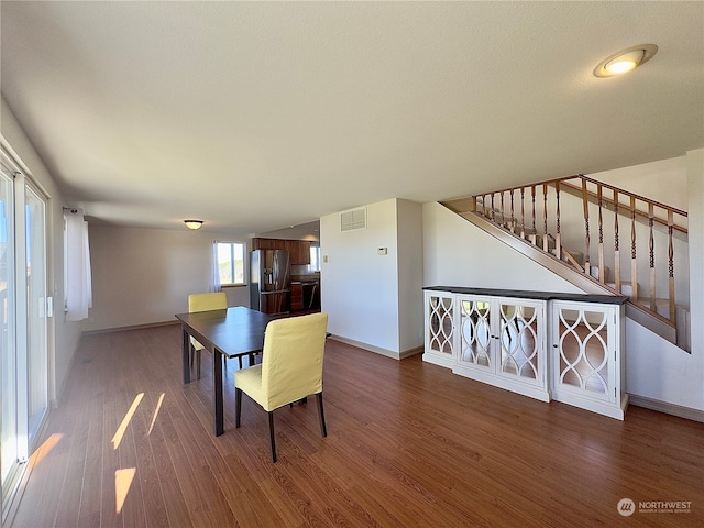 dining room with dark hardwood / wood-style flooring