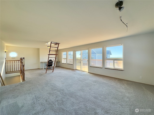 empty room featuring light carpet