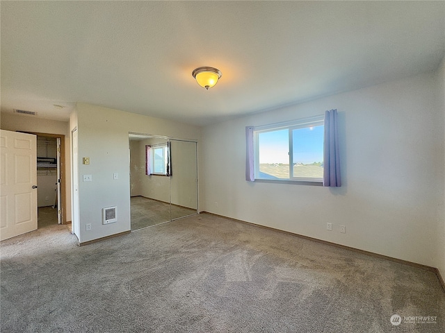 spare room with light carpet