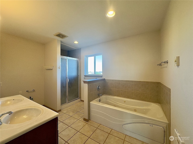 bathroom featuring shower with separate bathtub, dual vanity, and tile flooring