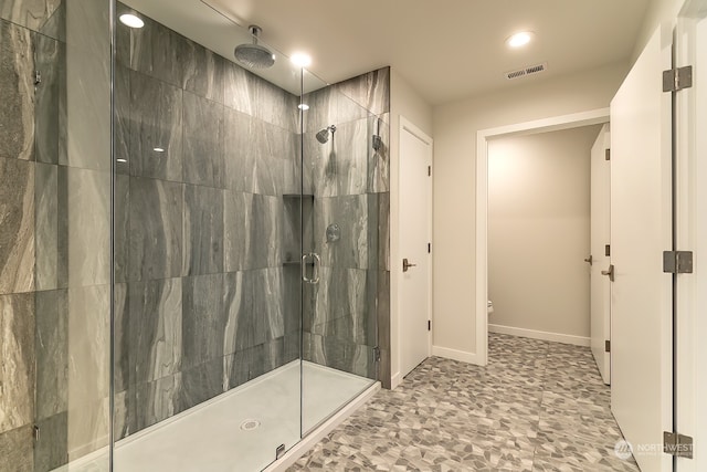 bathroom with toilet, recessed lighting, visible vents, baseboards, and a stall shower