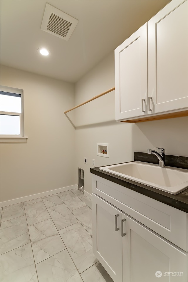 clothes washing area with hookup for a washing machine, hookup for an electric dryer, a sink, visible vents, and marble finish floor