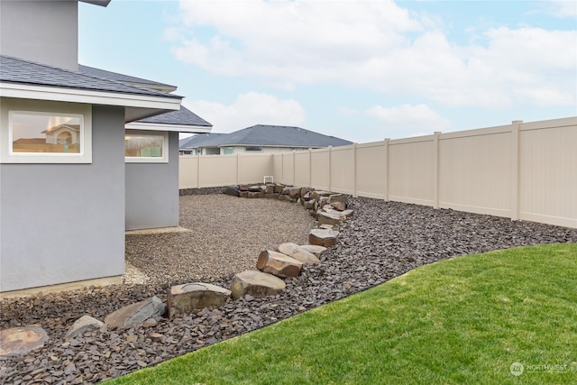 view of yard with a fenced backyard