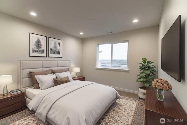 bedroom with recessed lighting, visible vents, and baseboards