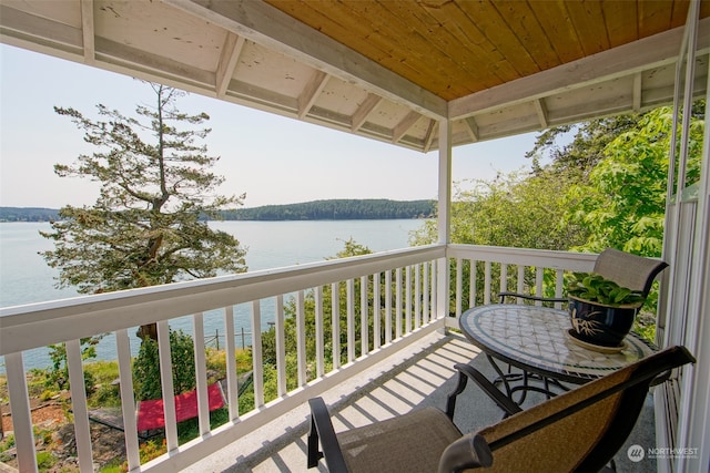 balcony featuring a water view