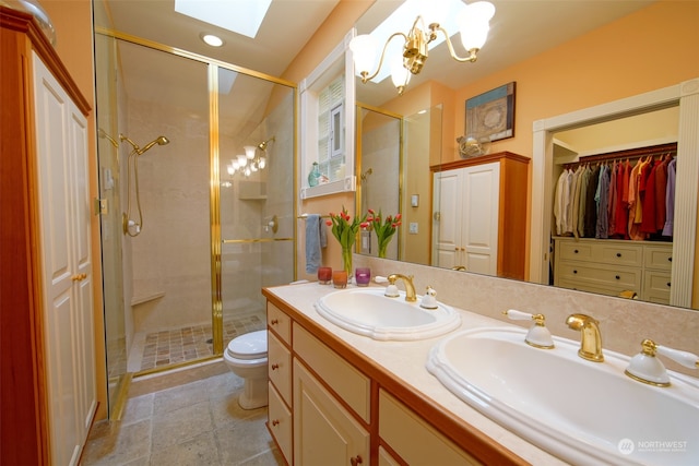 full bath with a skylight, a sink, and a stall shower