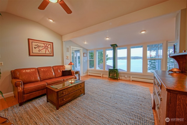 living room with a baseboard radiator, vaulted ceiling, and light wood-style floors
