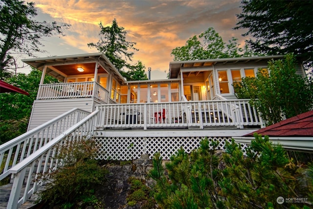 back of house at dusk with stairway