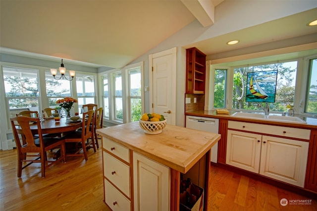 kitchen with open shelves, a sink, vaulted ceiling with beams, white dishwasher, and butcher block countertops