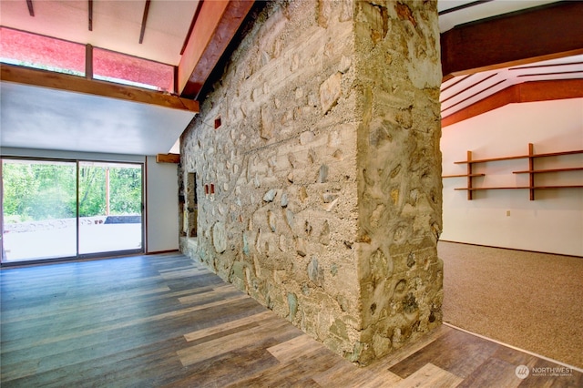 interior space with lofted ceiling with beams