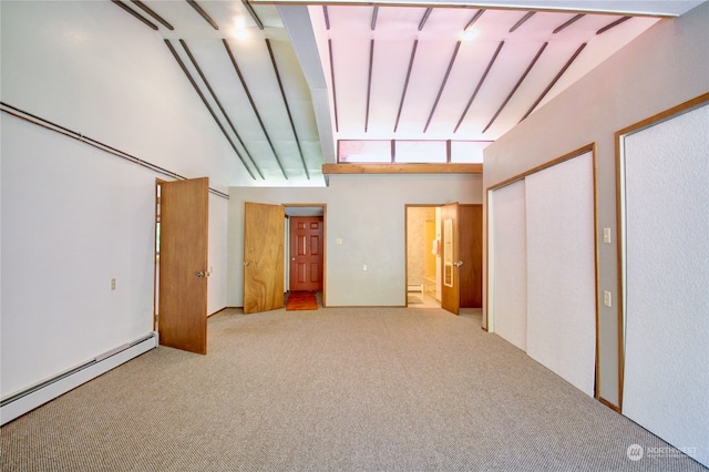 unfurnished bedroom featuring light colored carpet, high vaulted ceiling, and a baseboard radiator