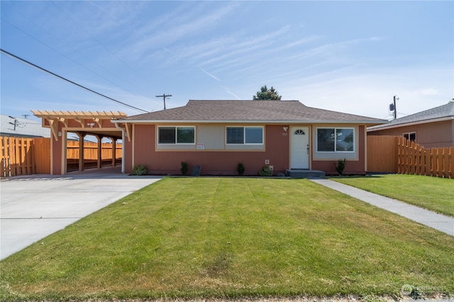 single story home featuring a front lawn