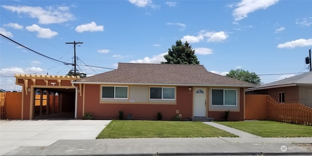 bungalow-style home with a front yard and a carport